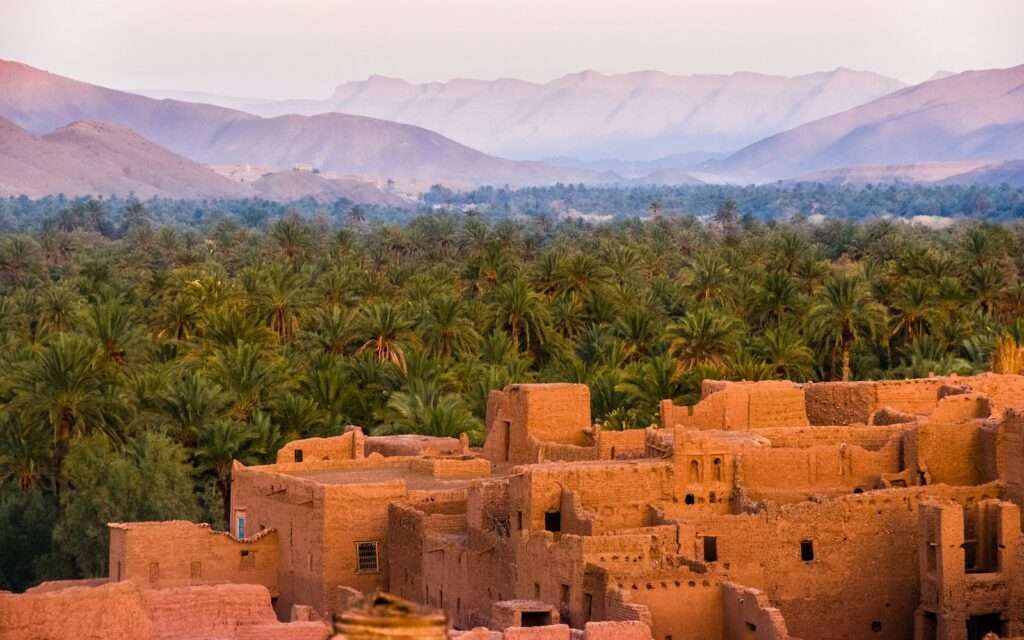 An earthen kasbah village above palm groves in southern Morocco